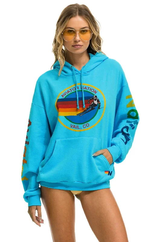 Women's cropped sweatshirt with a slogan graphic for a fun and expressive lookAVIATOR NATION VAIL RELAXED PULLOVER HOODIE - NEON BLUE