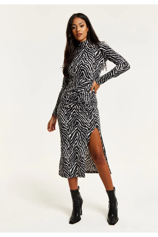 Midi dresses with ribbed textures for a unique and tactile appearanceLiquorish Brushed Knit Mono Zebra Print Midi Dress With Front Slit