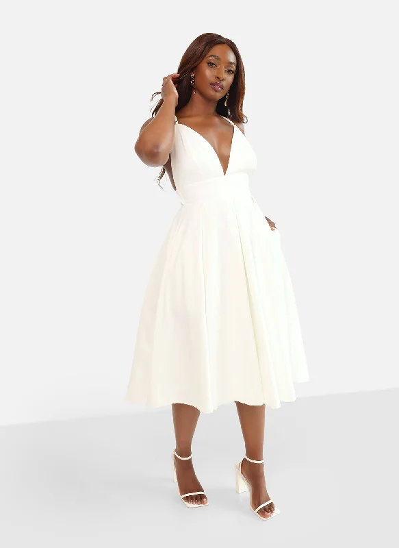 Midi dresses with polka dot prints for a playful summer outfitIris Criss Cross Back Midi Skater Dress