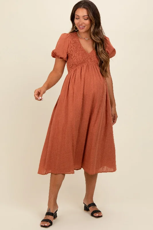 Midi dresses with ruffled bodices for a more pronounced feminine lookRust Smocked V-Neck Puff Sleeve Maternity Midi Dress