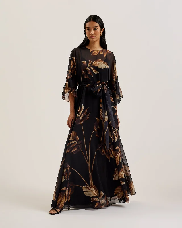 Maxi dresses with fringe trim for a bohemian vibeCalama Sheer Printed Maxi Dress With Slit Black Maxi dresses with fringe trim for a bohemian vibeCalama Sheer Printed Maxi Dress With Slit Black
