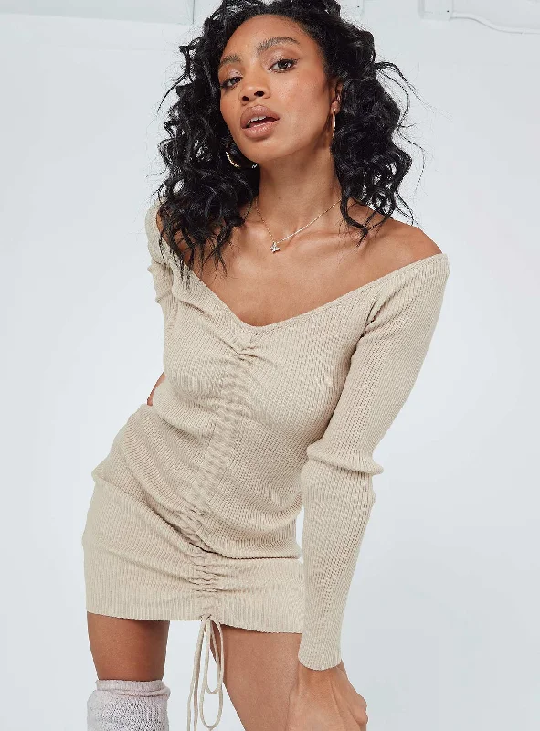 Bodycon dress with a cut - out detail for a sexy appealAvanti Long Sleeve Mini Dress Beige Bodycon dress with a cut - out detail for a sexy appealAvanti Long Sleeve Mini Dress Beige
